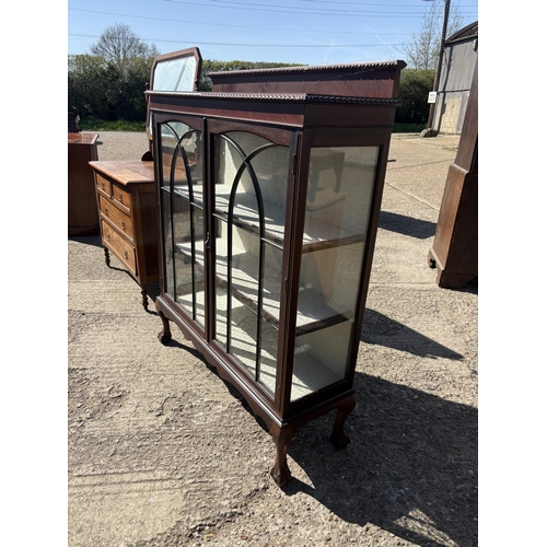 245 - A large mahogany display cabinet on ball and claw feet 120x40x140