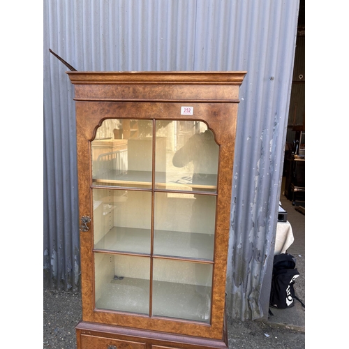 252 - A burr walnut cabinet 56x30x177