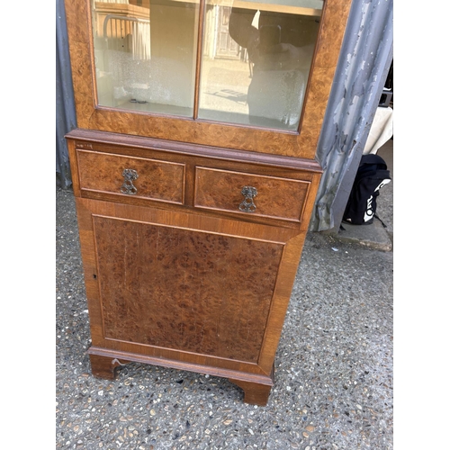 252 - A burr walnut cabinet 56x30x177