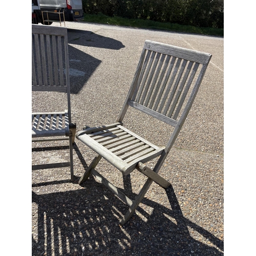 255 - A pair of hardwood folding garden chairs