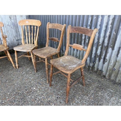 260 - A pair of Windsor chairs, two pine chairs and a wheel back carver