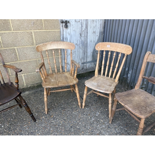 260 - A pair of Windsor chairs, two pine chairs and a wheel back carver