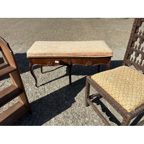 261 - A French mahogany duet piano stool, carved oak chair and a wall shelf