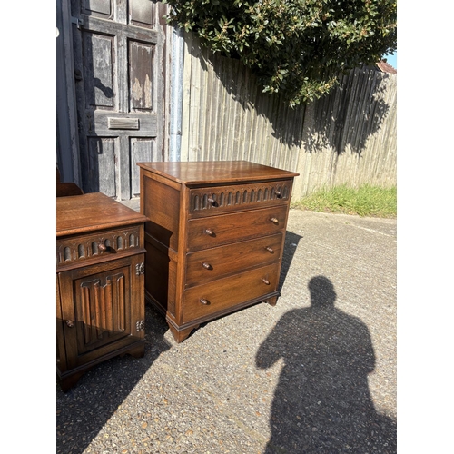 277 - A good quality 20th linenfold pattern oak bedroom suite consisting of a double wardrobe, chest of dr... 