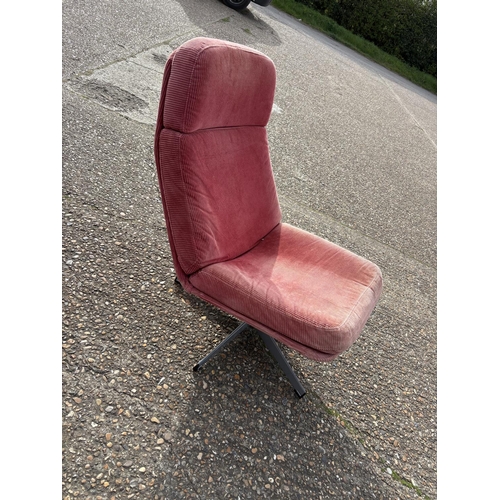 282 - A mid century red upholstered swivel chair on star form base