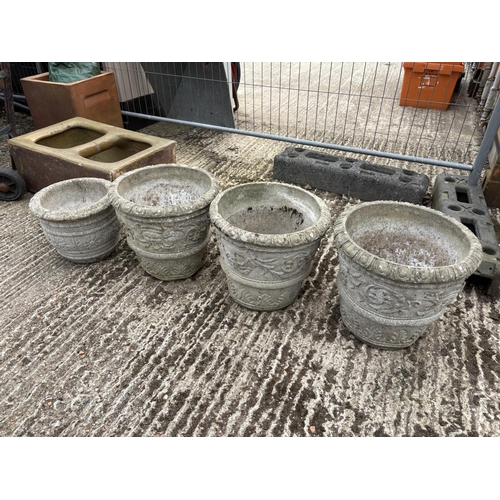 476 - Four large concrete planters, largest 36 cms high, 36 cms diameter