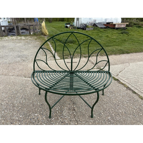 479 - A green painted metal garden bench seat 120cm wide