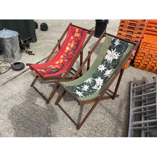 485 - A pair of hardwood deck chairs