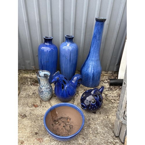 491 - A collection of blue glazed items including pair of vases, tall vase height 90 cms, chicken, fish an... 