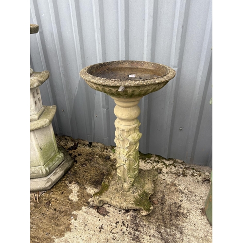 495 - An ornate concrete pedestal bird bath, height 75 cms, diameter 40 cms
