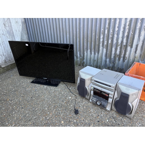 59 - A large TV and a hifi system