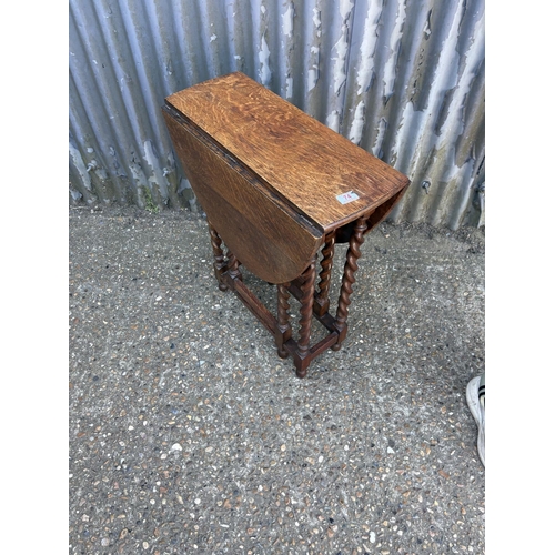 74 - A good quality slim oak barley twist gate leg table 60x23