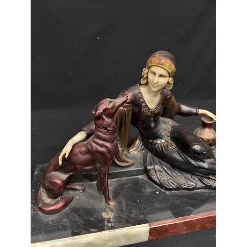 602 - Art Deco Lady & Dog Figure, on heavy marble base, length 58 cms, width 21 cms