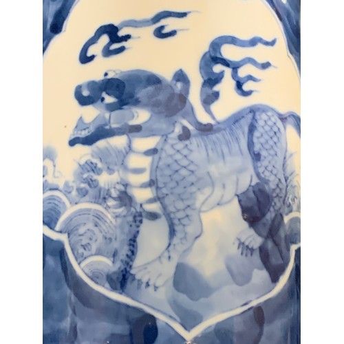 559 - Oriental blue and white Dog of Foe vase, height 26cms