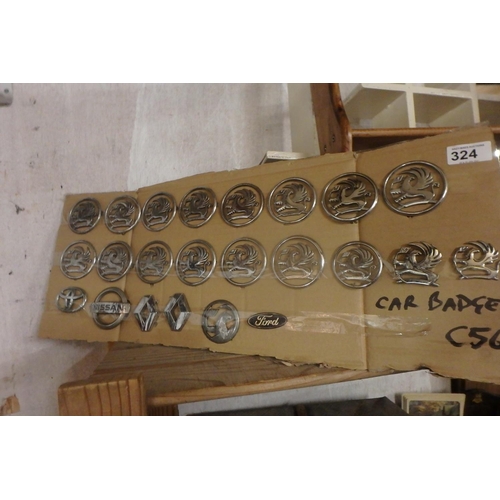 324 - CAR BADGES MOUNTED ON CARDBOARD