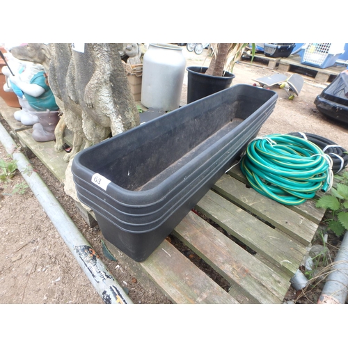 63 - 4 PLASTIC PLANTERS