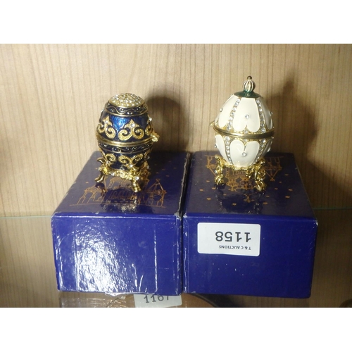 1158 - TWO ATLAS EDITIONS DECORATIVE EGGS - HIGHLY ORNATE ENAMELLING, DIAMONTE ACCENTS AND MAGNETIC CLOSURE... 