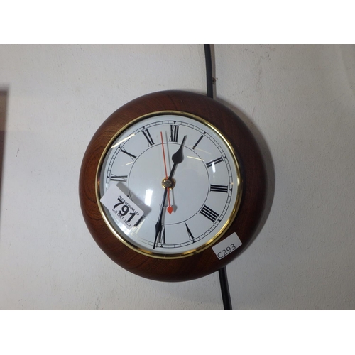 791 - SMALL WOOD AND BRASS QUARTZ WALL CLOCK