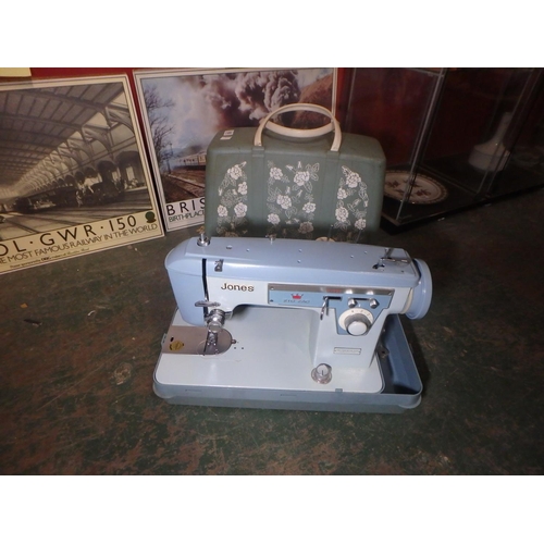 1552 - JONES ELECTRIC SEWING MACHINE IN BOX