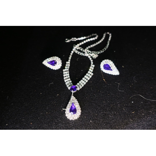 1509 - DIAMONTE AND PURPLE STONE NECKLACE AND CLIP ON EARRINGS