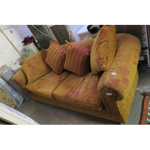 628 - LARGE RED AND GOLD PATTERENED SOFA WITH MATCHING CUSHIONS VERY GOOD CONDITION AND VERY COMFORTABLE