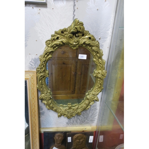 1209 - A PLASTER FRAMED DECORATIVE WALL MIRROER