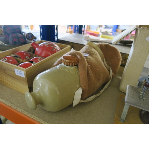 1268 - A CERAMIC HOT WATER BOTTLE IN FLEECE BAG