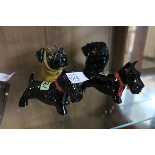 1340 - TWO CERAMIC PUG, AND TWO CERAMIC SCOTTIE DOG FIGURINES