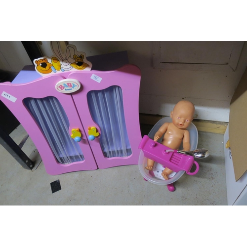 762 - BABY BORN DOLL CABINET WITH BABY AND BATH