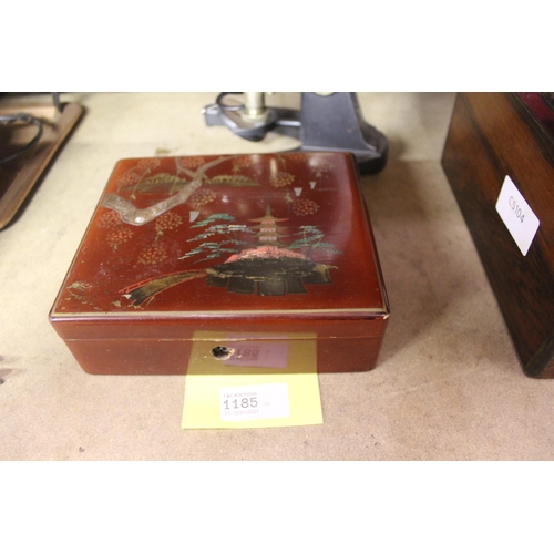 1185 - JAPANESE RED LACQUERED JEWELLERY BOX WITH PINK SILK LINING