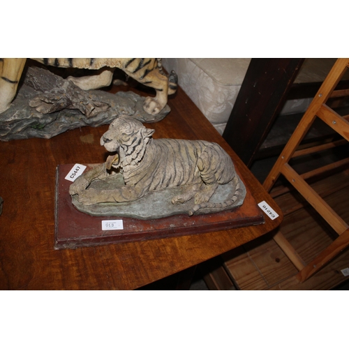 913 - LARGE YAWNING LYING TIGER ON WOODEN BASE