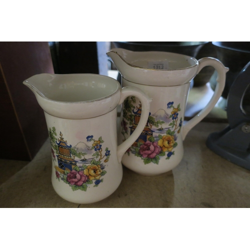 1312 - TWO VINTAGE CHINA PITCHER JUGS WITH JAPANESE GARDEN MOTIF