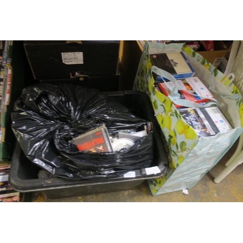 1059 - LARGE BAG OF DVDS AND CASES WITH A TUB OF CDS AND CASES