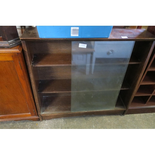 843 - GLASS FRONT BOOKCASE