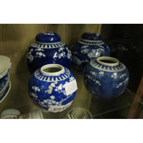 1233 - COLLECTION OF FOUR TRADITIONAL CHINESE BLUE & WHITE GINGER JARS IN ICONIC 