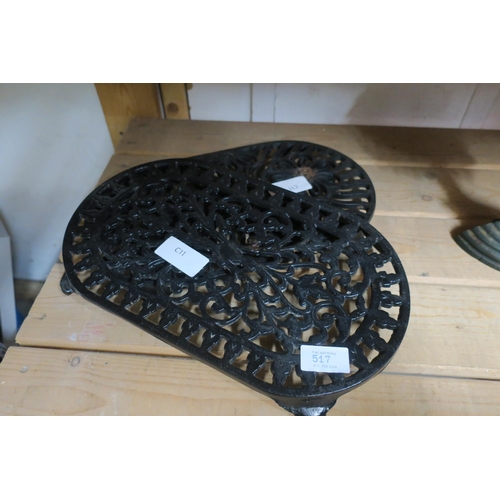 517 - A SET OF TWO CAST IRON POT STANDS