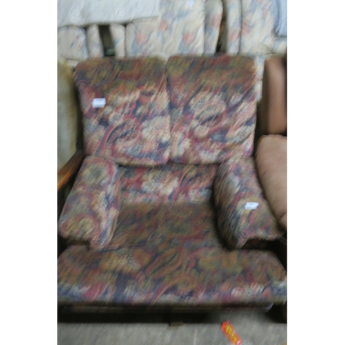 909 - A LARGE HEAVY PATTERNED SPINNING FIRESIDE CHAIR