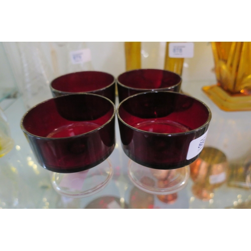 881 - FOUR RUBY RED GLASS DESSERT DISHES ON STEMS