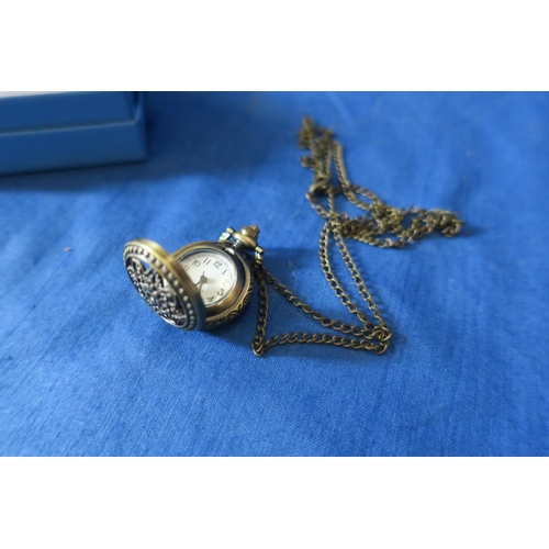 934 - SMALL ORNATE VINTAGE FOB WATCH WITH LONG CHAIN NECKLACE