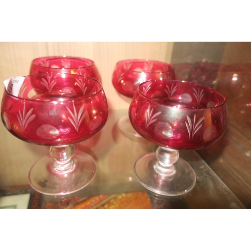 638 - SET OF FOUR CRANBERRY GLASS CHAMPAGNE COUPS