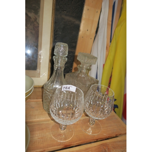 784 - PAIR OF CUT CRYSTAL BRANDY GLASES AND TWO DECANTERS