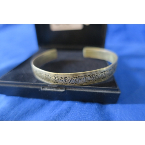 848 - POSSIBLE INDIAN SILVER BANGLE