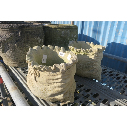 137 - PAIR OF CONCRETE SACK PLANTERS