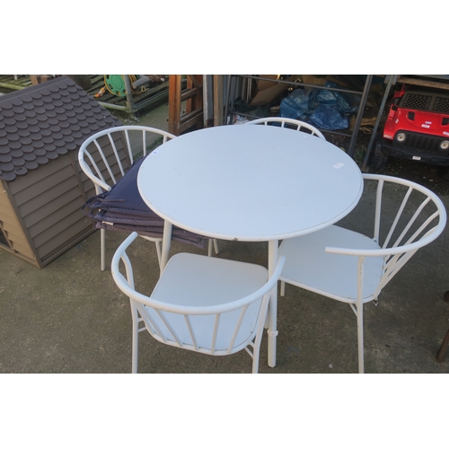 46 - ROUND METAL BISTRO TABLE AND 4 CHAIRS WITH SEAT PADS