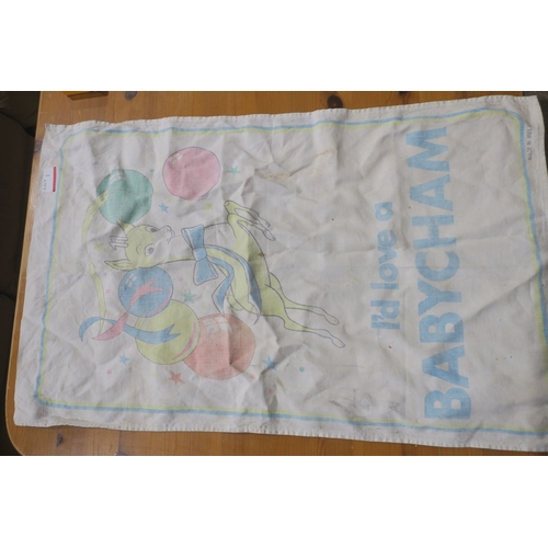 1 - AN ORIGINAL THOUGH SLIGHTLY FADED BABYCHAM TEA TOWEL