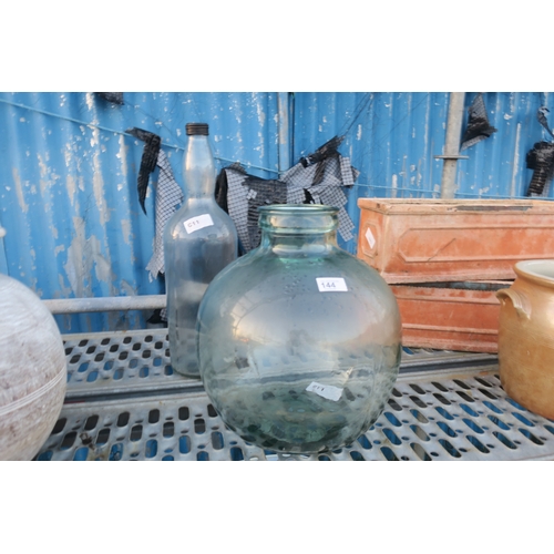 144 - GREEN GLASS CARBOY AND LARGE BOTTLE