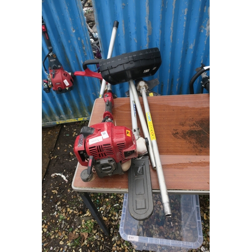 28 - RED STRIMMER WITH ATTACHMENTS