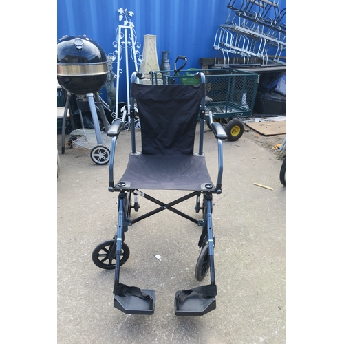 62 - FOLDABLE WHEELCHAIR WITH ATTACHED FOOT RESTS