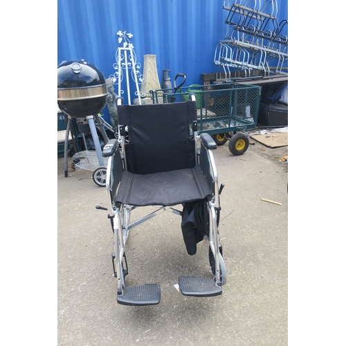 66 - FOLDING WHEELCHAIR