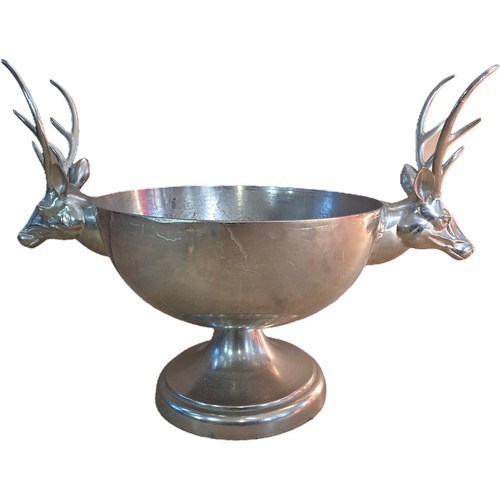 21 - A very large antique style polished metal 24 bottle champagne cooler in the form of a footed bowl, w... 